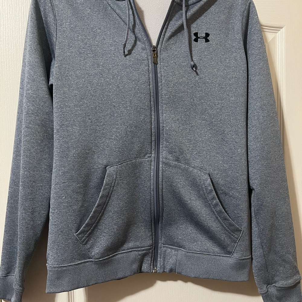 Under Armour Women’s size medium zip-up hooded jacket.